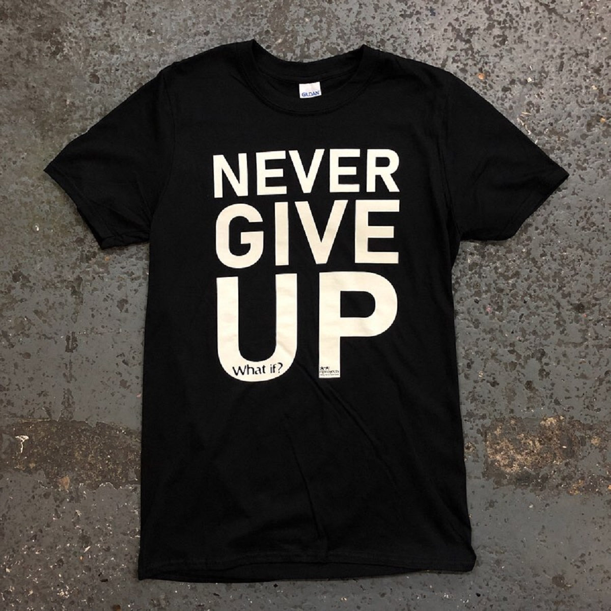 A black Tshirt with the words Never Give Up written on it